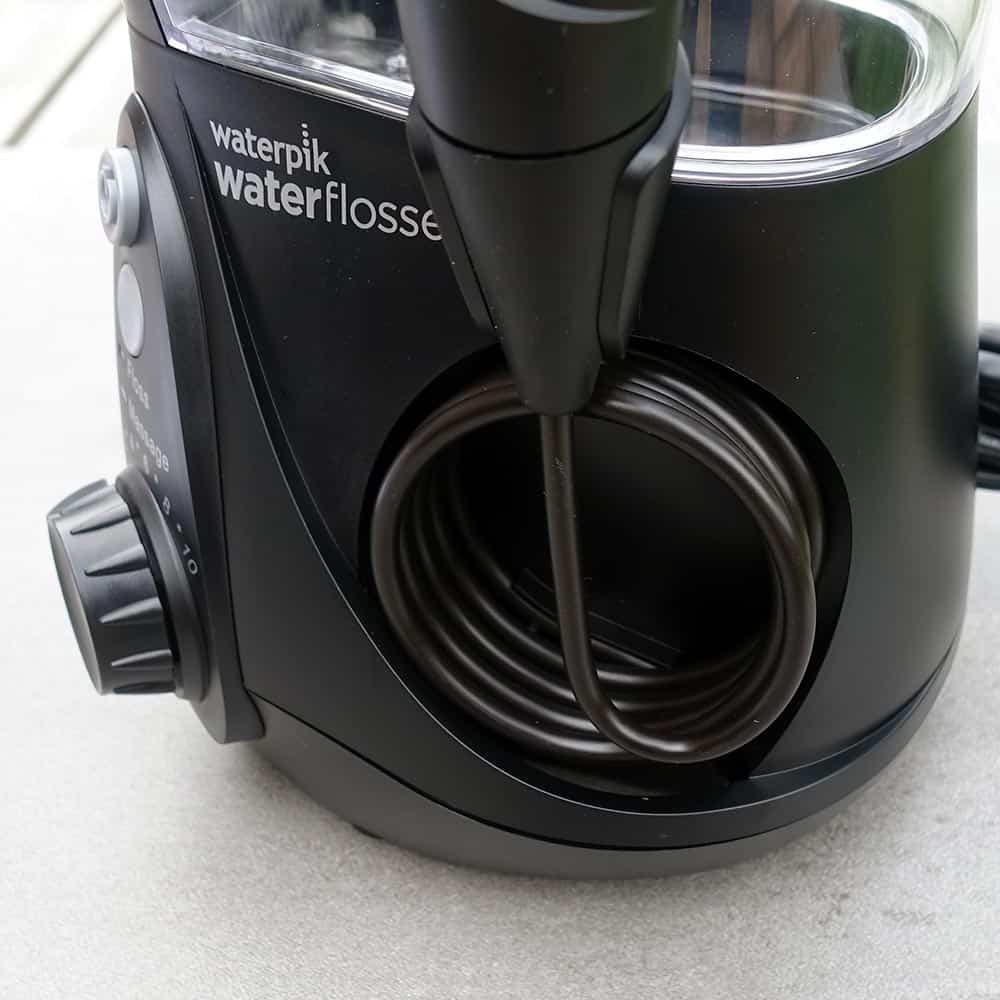Close up view of the hose that attaches to the hanlde of the Waterpik flosser.