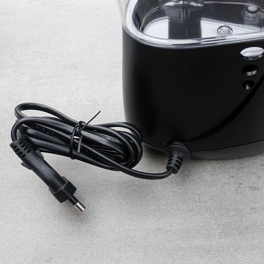 Power supply existing from the back of the Waterpik Aquarius