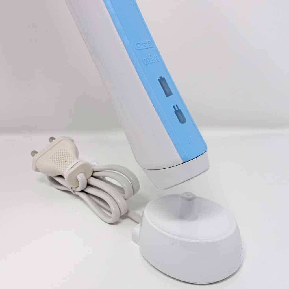 Pro 600 toothbrush being placed on charging stand