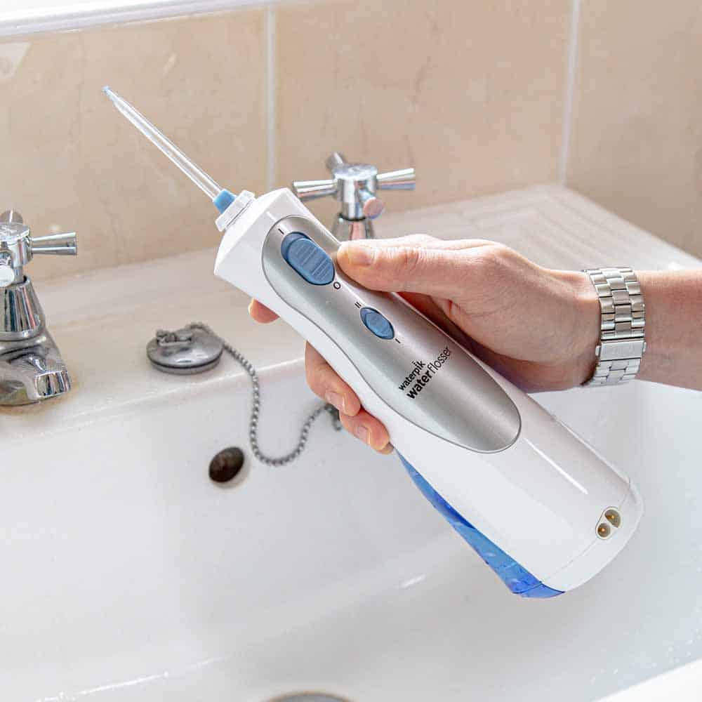 Waterpik Cordless Plus Water Flosser in the hand