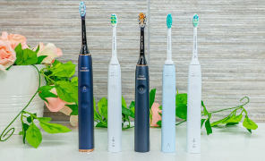Sonicare electric toothbrushes stood next to each other