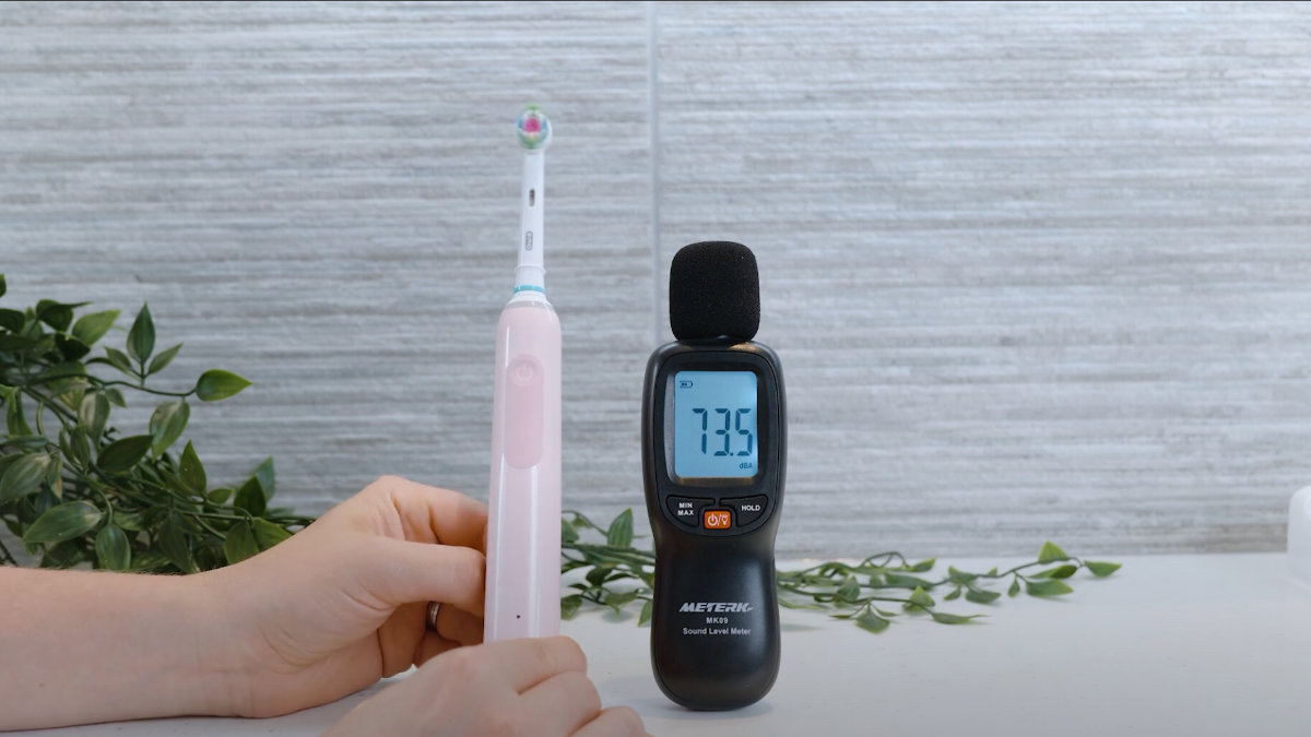 Oral-B Pro 3 being sound tested next to a decibel reader