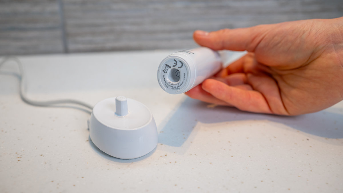 The Pro 3 next to its charging stand