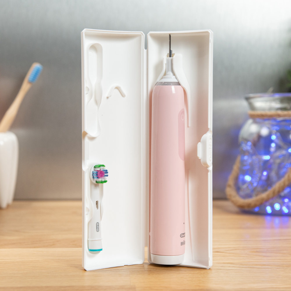 Oral-B Pro 3 in its travel case with a brush head