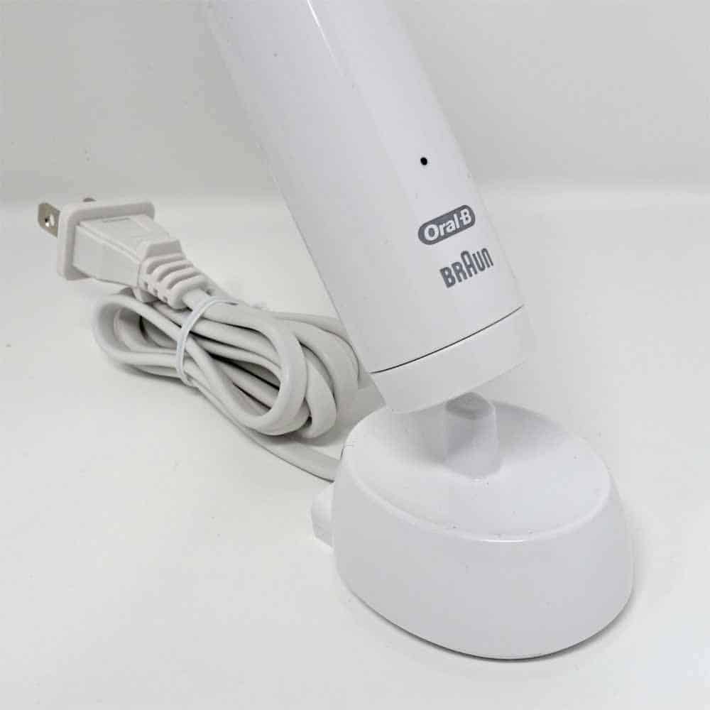 Smart 1500 toothbrush being placed on charging stand