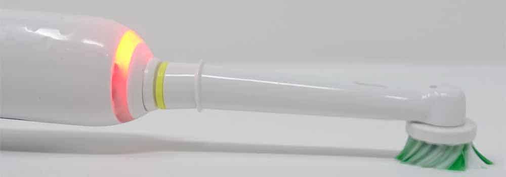 Pressure sensor lit red as bristles splay on surfac