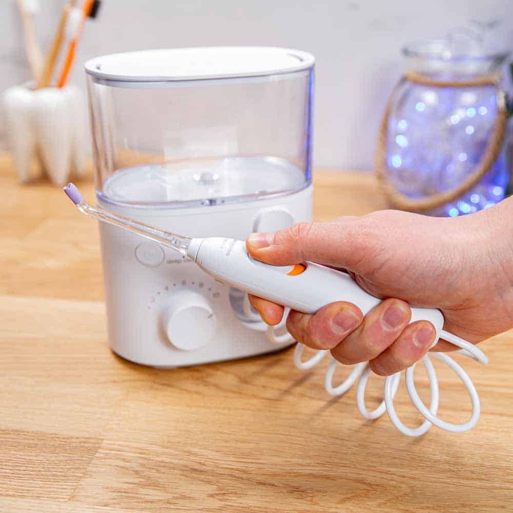 Philips Sonicare Power Flosser handle being held in the hand