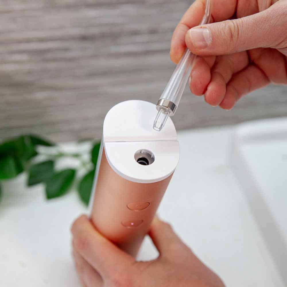 Magnetic flossing tip on Quip flosser