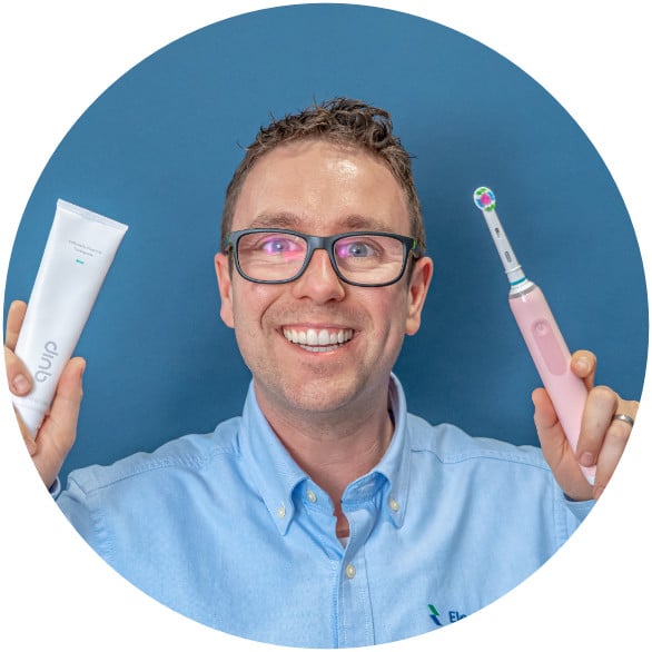 jon holding toothpaste and toothbrush