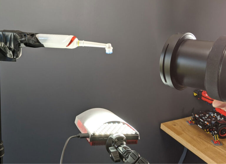 An electric toothbrush being filmed during our testing process