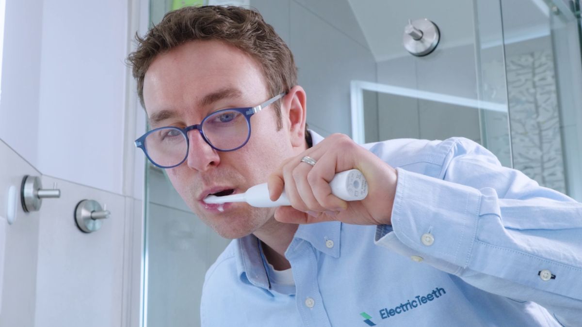 Jon using a Sonicare toothbrush