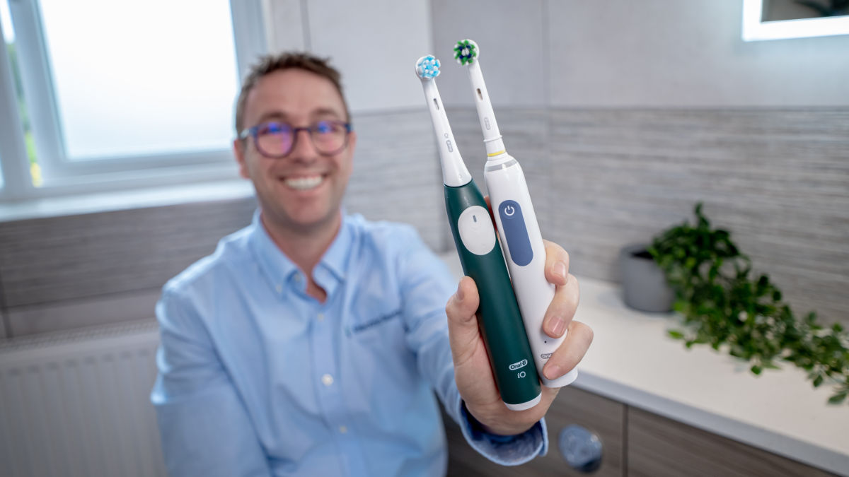 Oral-B iO2 and Smart 1500 being held side by side